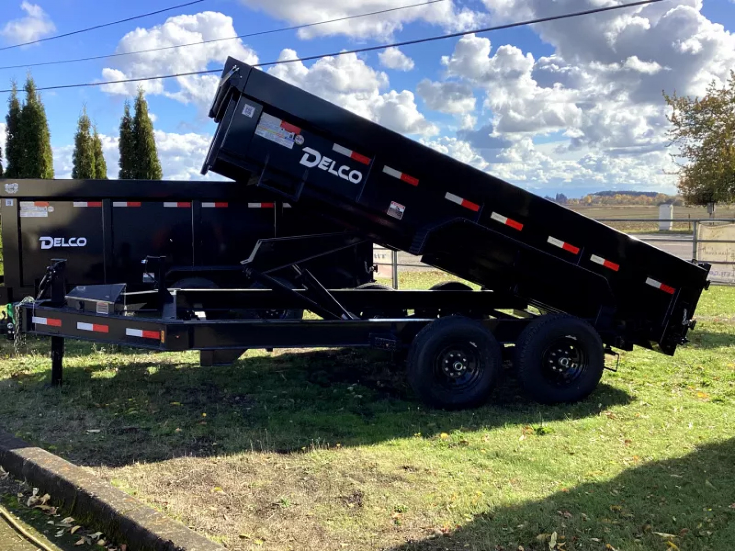 New 2026 Delco Dump Trailer 7x14 -14K - Split/Spreader gate - Black- 2' Solid Sides, 6' slide in ramps