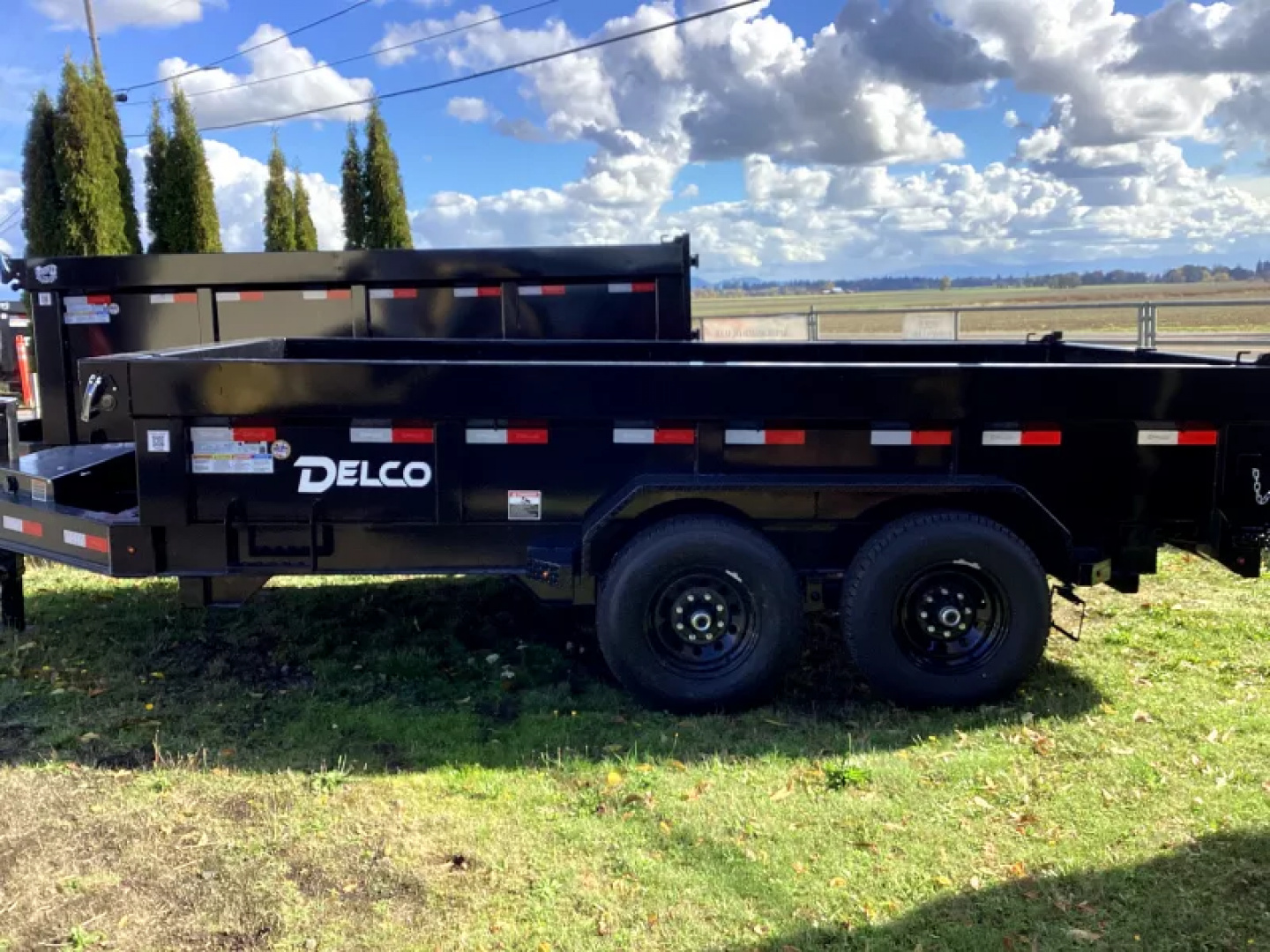 New 2026 Delco Dump Trailer 7x14 -14K - Split/Spreader gate - Black- 2' Solid Sides, 6' slide in ramps
