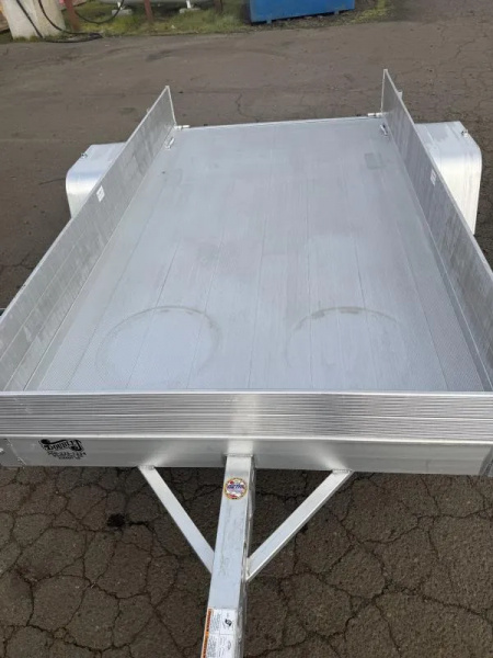New 2026 Aluma 63" X 10' Aluminum Deck-12" solid front and sides, U-bolt spare tire mount, strt tailgate, 13" steel wheels