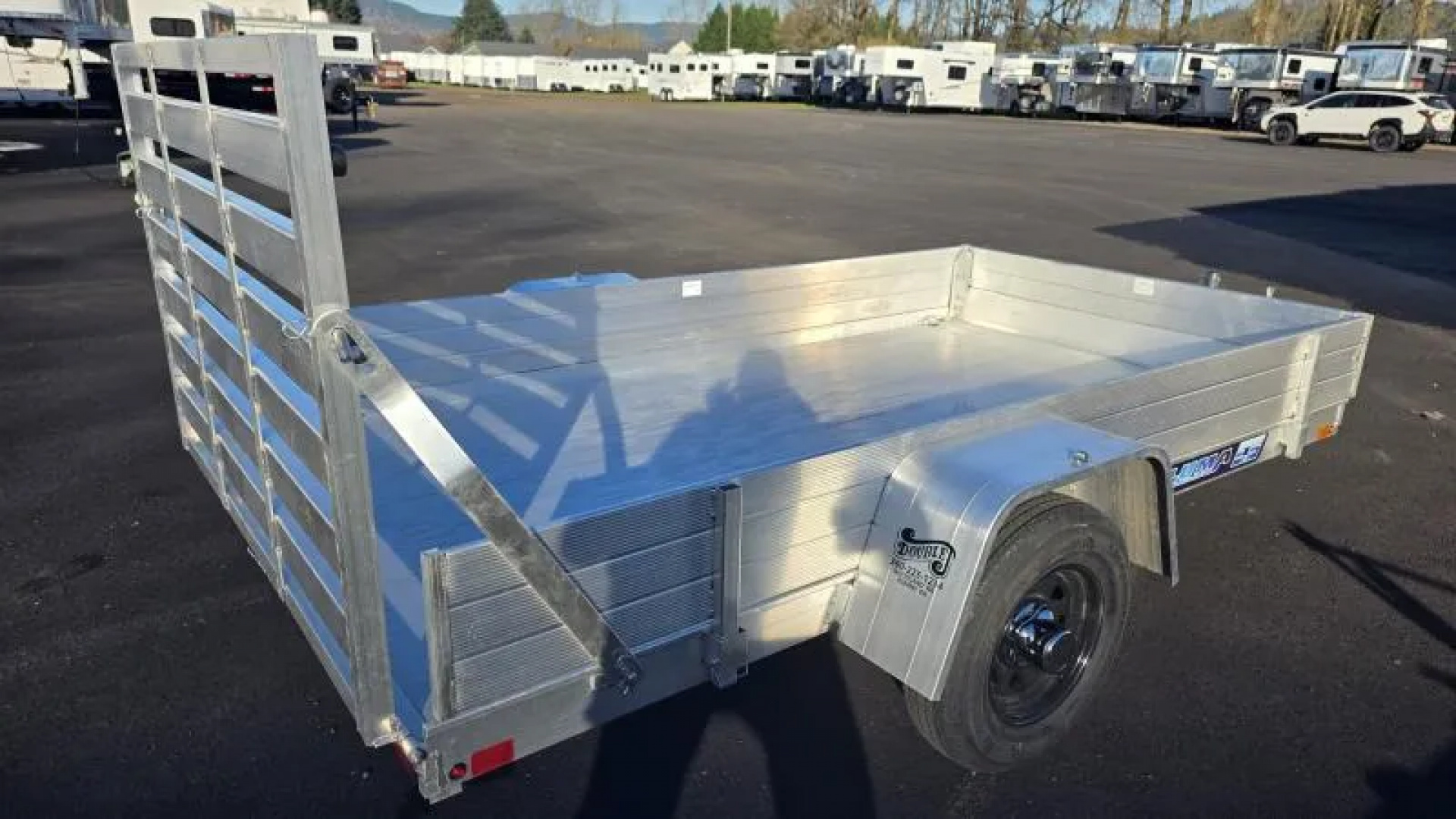 New 2026 Aluma 63" X 10' Aluminum Deck-12" Solid Front and Sides, U-bolt Spare Tire Mount, Strt Tailgate, 13" Steel Wheels Utility Trailer