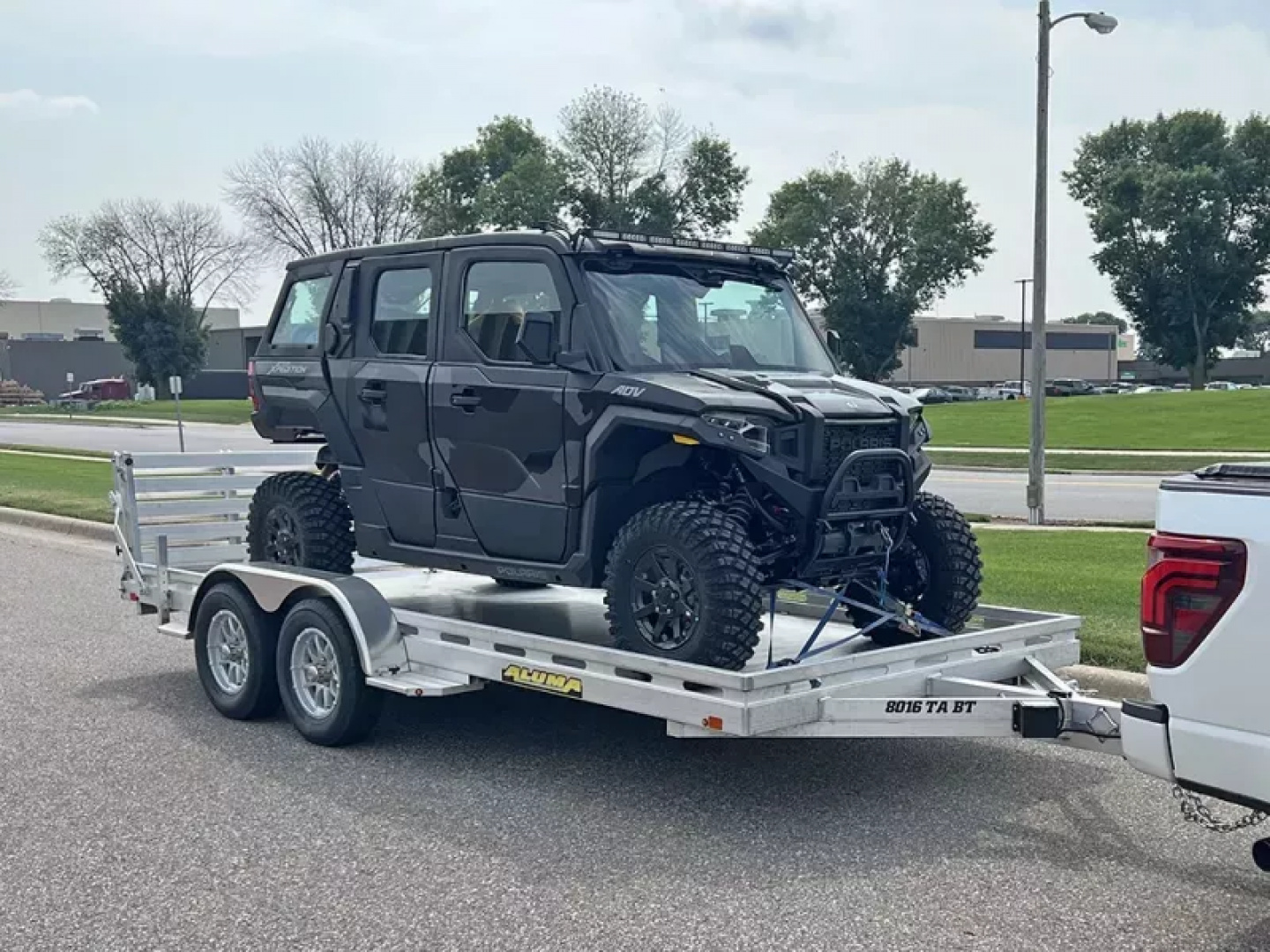 New 2027 Aluma 80x14' Tandem Axle, Bi-Fold Tailgate Slotted Rail, Electric Brake, Spare Tire, 15" Silver Alum Tires