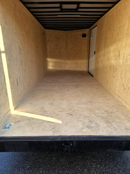 New 2025 7x16 contractor trailer with barn doors and ladder racks - Covered Wagon