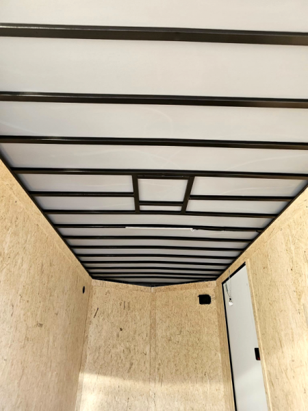 New 2025 7x16 contractor trailer with barn doors and ladder racks - Covered Wagon