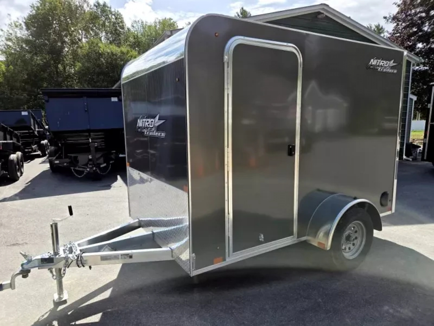 New 2026 6X10 ENCLOSED CARGO TRAILER FLAT FORNT WITH REAR RAMP TORSION AXLE - Nitro