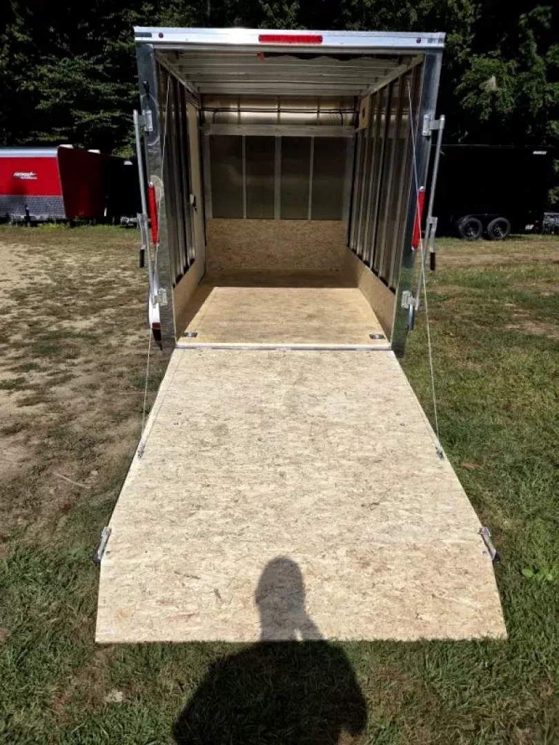 New 2026 6X10 ENCLOSED CARGO TRAILER FLAT FORNT WITH REAR RAMP TORSION AXLE - Nitro