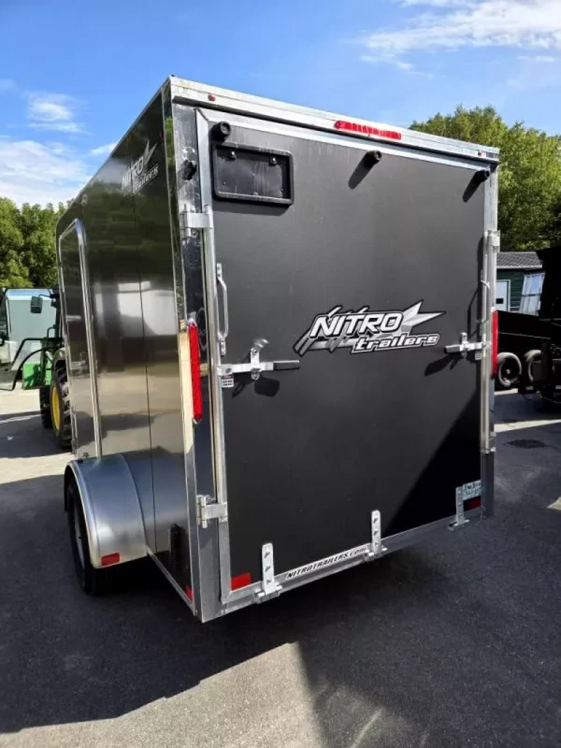 New 2026 6X10 ENCLOSED CARGO TRAILER FLAT FORNT WITH REAR RAMP TORSION AXLE - Nitro