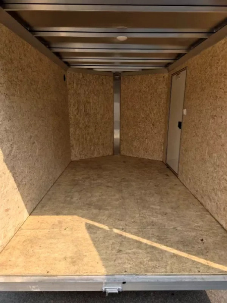 Used 2025 6.5x10 Aluminum enclosed cargo trailer with barn doors - High Country Trailers
