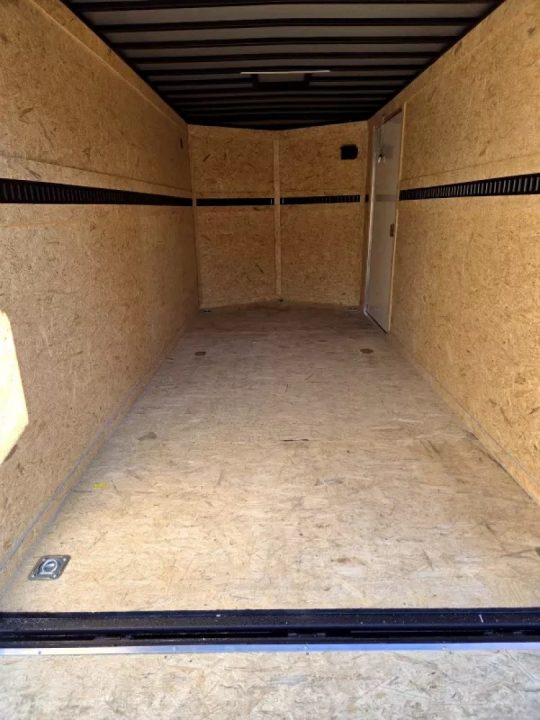 New 2026 7x16 extra height cargo trailer with e trac and rear ramp - Covered Wagon