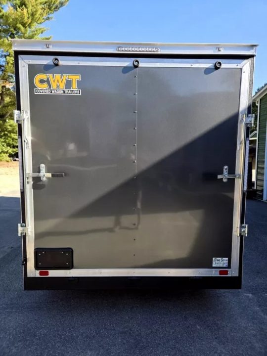 New 2026 7x16 extra height cargo trailer with e trac and rear ramp - Covered Wagon