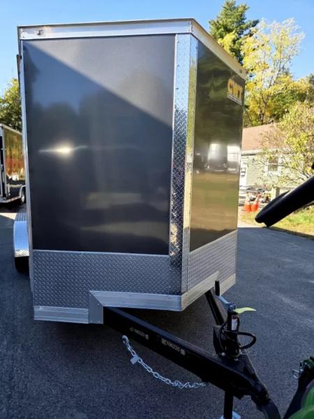 New 2026 7x16 extra height cargo trailer with e trac and rear ramp - Covered Wagon