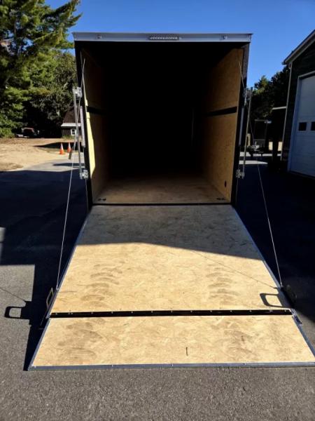New 2026 7x16 extra height cargo trailer with e trac and rear ramp - Covered Wagon