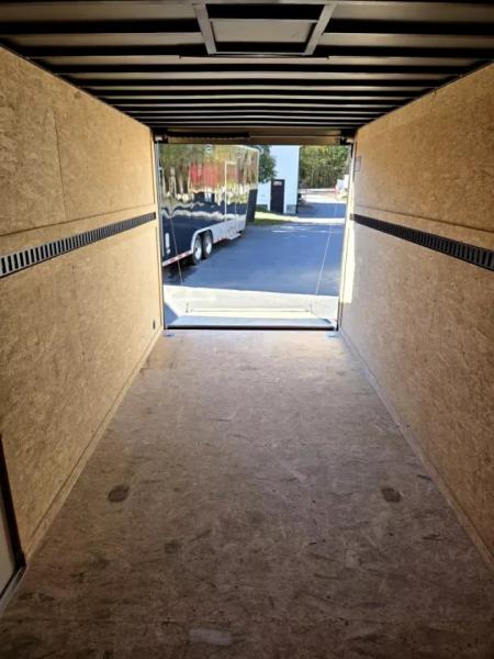 New 2026 7x16 extra height cargo trailer with e trac and rear ramp - Covered Wagon