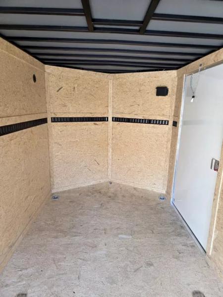 New 2026 7x16 extra height cargo trailer with e trac and rear ramp - Covered Wagon