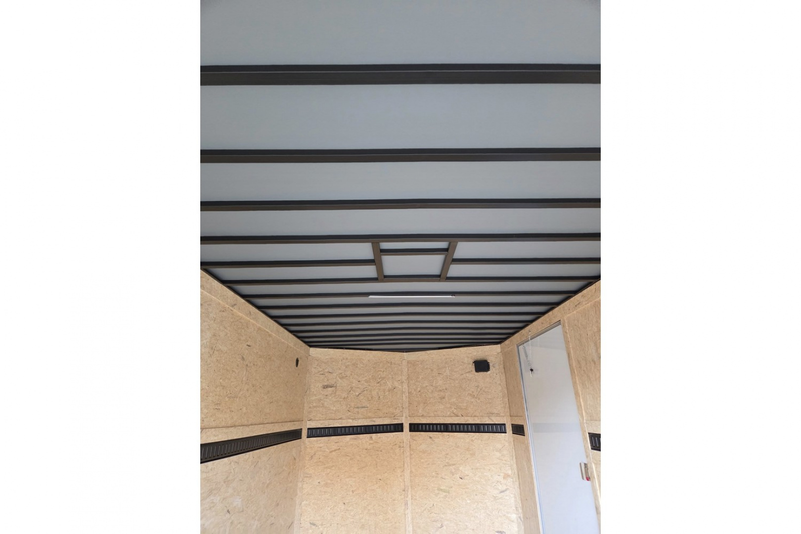 New 2026 8.5x16 extra height enclosed cargo trailer with wall e trac and poly core siding rear ramp door - Covered Wagon