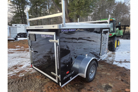 New 2026 5x10 enclosed cargo trailer with barn doors and ladder racks - Haul-About