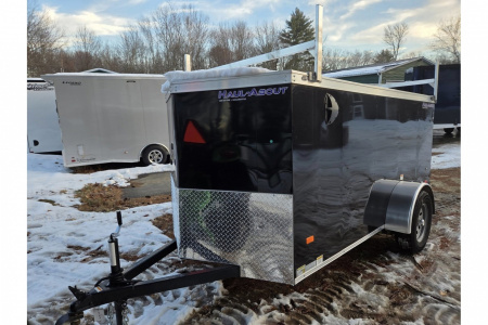 New 2026 5x10 enclosed cargo trailer with barn doors and ladder racks - Haul-About