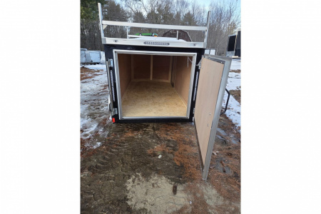 New 2026 5x10 enclosed cargo trailer with barn doors and ladder racks - Haul-About