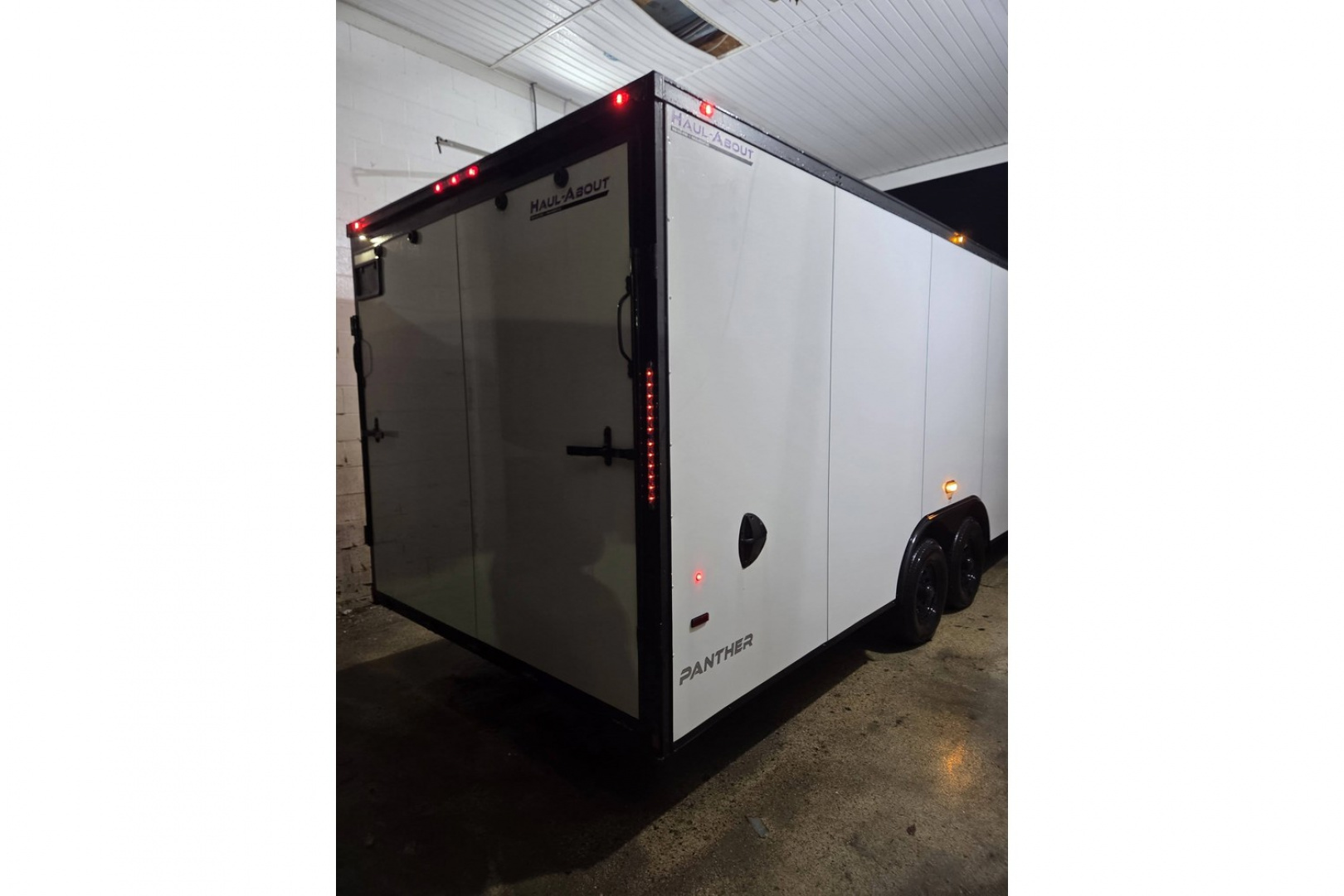 New 2026 8.5X24 9990LB GVWR ENCLOSED CAR HAULER EXTRA HEIGHT WHITE WITH BLAKC OUT TRIM PACKAGE - Haul-About