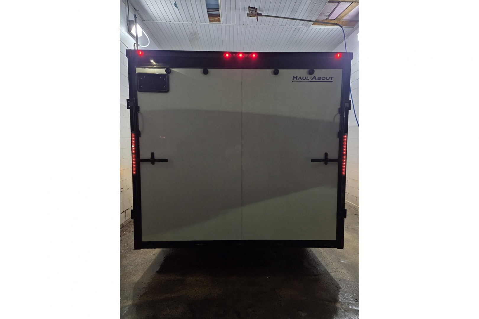 New 2026 8.5X24 9990LB GVWR ENCLOSED CAR HAULER EXTRA HEIGHT WHITE WITH BLAKC OUT TRIM PACKAGE - Haul-About