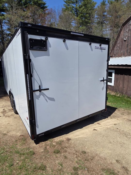 New 2026 8.5X24 9990LB GVWR ENCLOSED CAR HAULER EXTRA HEIGHT WHITE WITH BLAKC OUT TRIM PACKAGE - Haul-About
