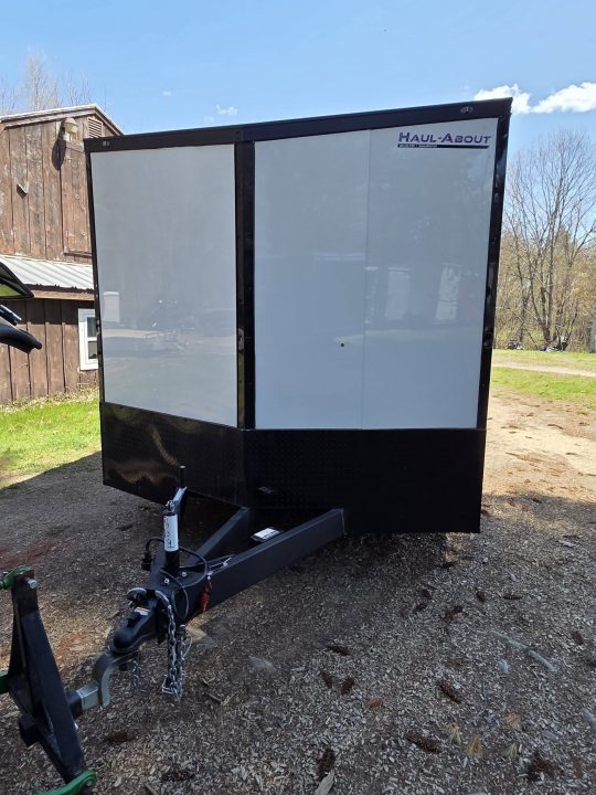 New 2026 8.5X24 9990LB GVWR ENCLOSED CAR HAULER EXTRA HEIGHT WHITE WITH BLAKC OUT TRIM PACKAGE - Haul-About