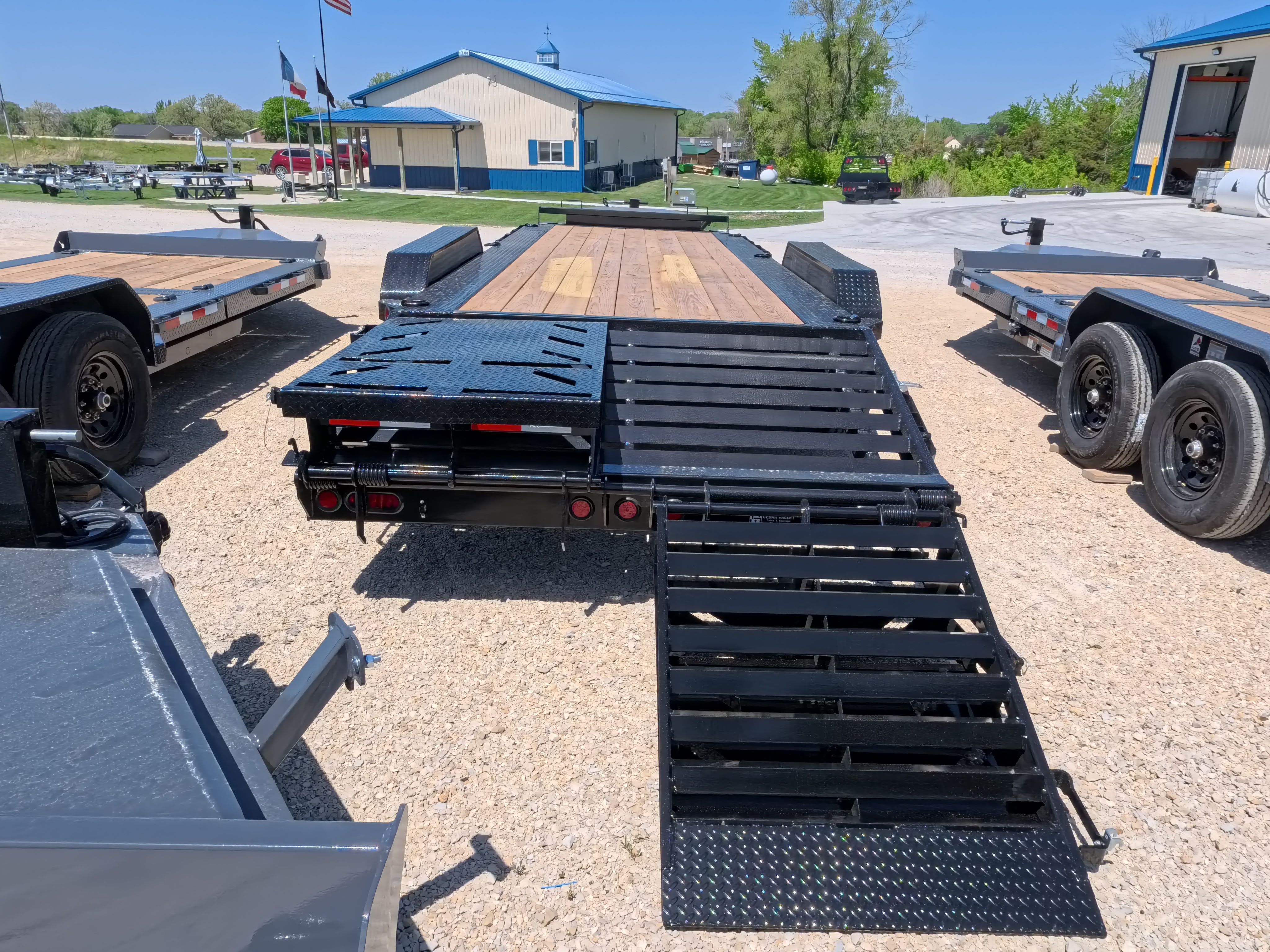 New 2026 Iron Bull 83 X 22 EHB Equipment Trailer w/2- 10K Axles, 4' Self Cleaning Dove Tail and 4' Rampage Ramps, Adj. 25K Coupler and 2 5/16" Receiver , LRJ 18 Ply Tires