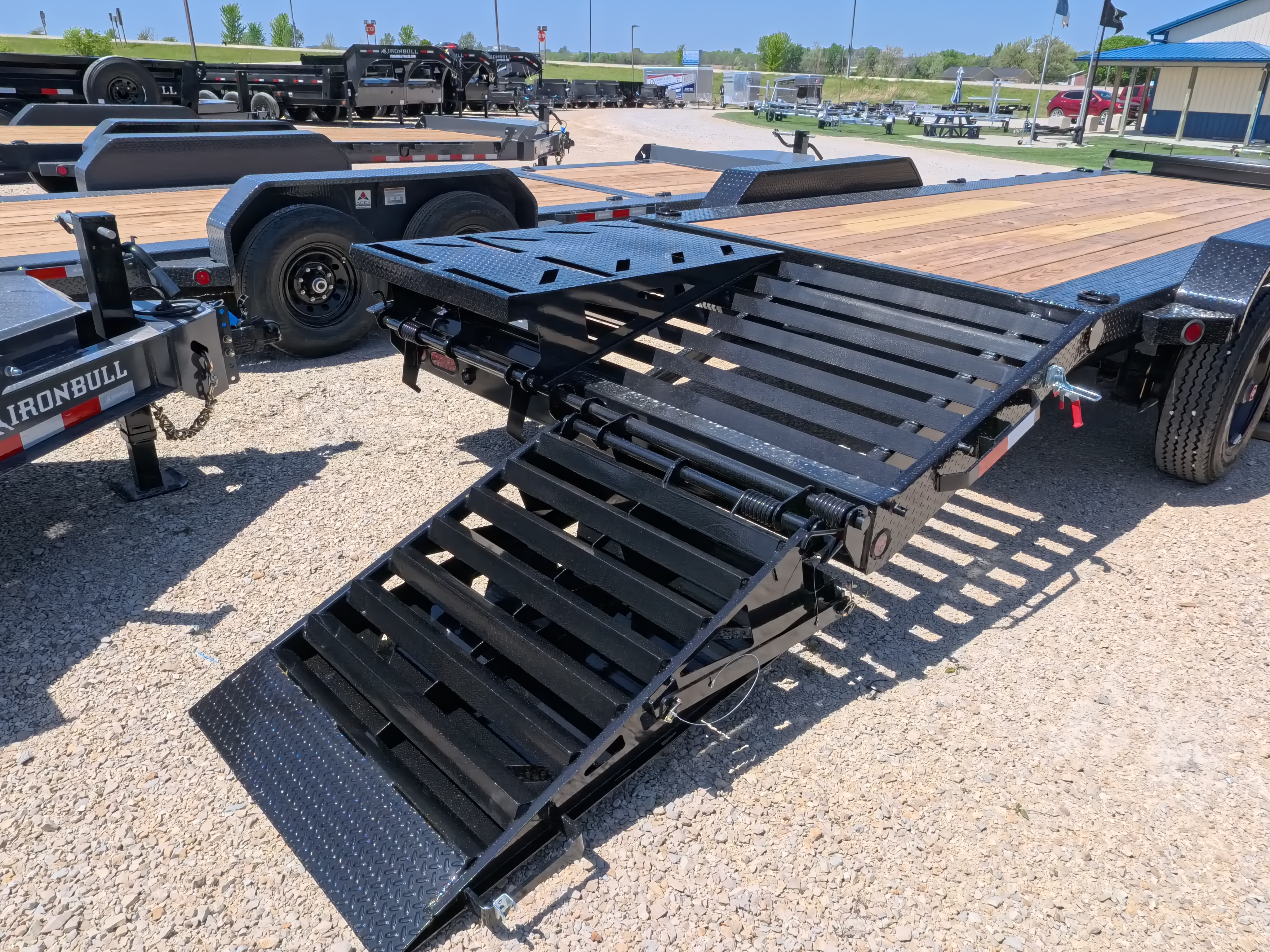 New 2026 Iron Bull 83 X 22 EHB Equipment Trailer w/2- 10K Axles, 4' Self Cleaning Dove Tail and 4' Rampage Ramps, Adj. 25K Coupler and 2 5/16" Receiver , LRJ 18 Ply Tires