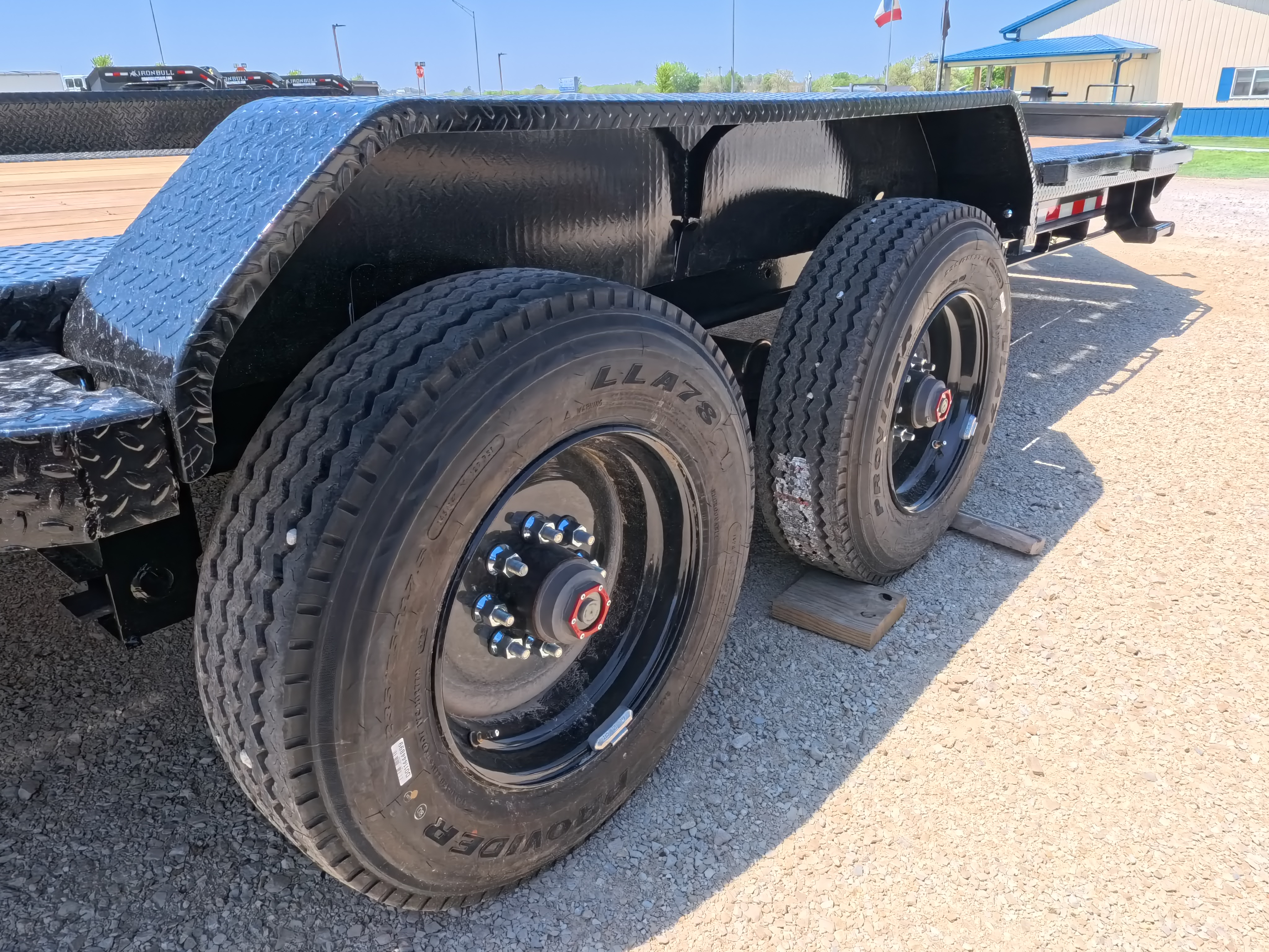 New 2026 Iron Bull 83 X 22 EHB Equipment Trailer w/2- 10K Axles, 4' Self Cleaning Dove Tail and 4' Rampage Ramps, Adj. 25K Coupler and 2 5/16" Receiver , LRJ 18 Ply Tires