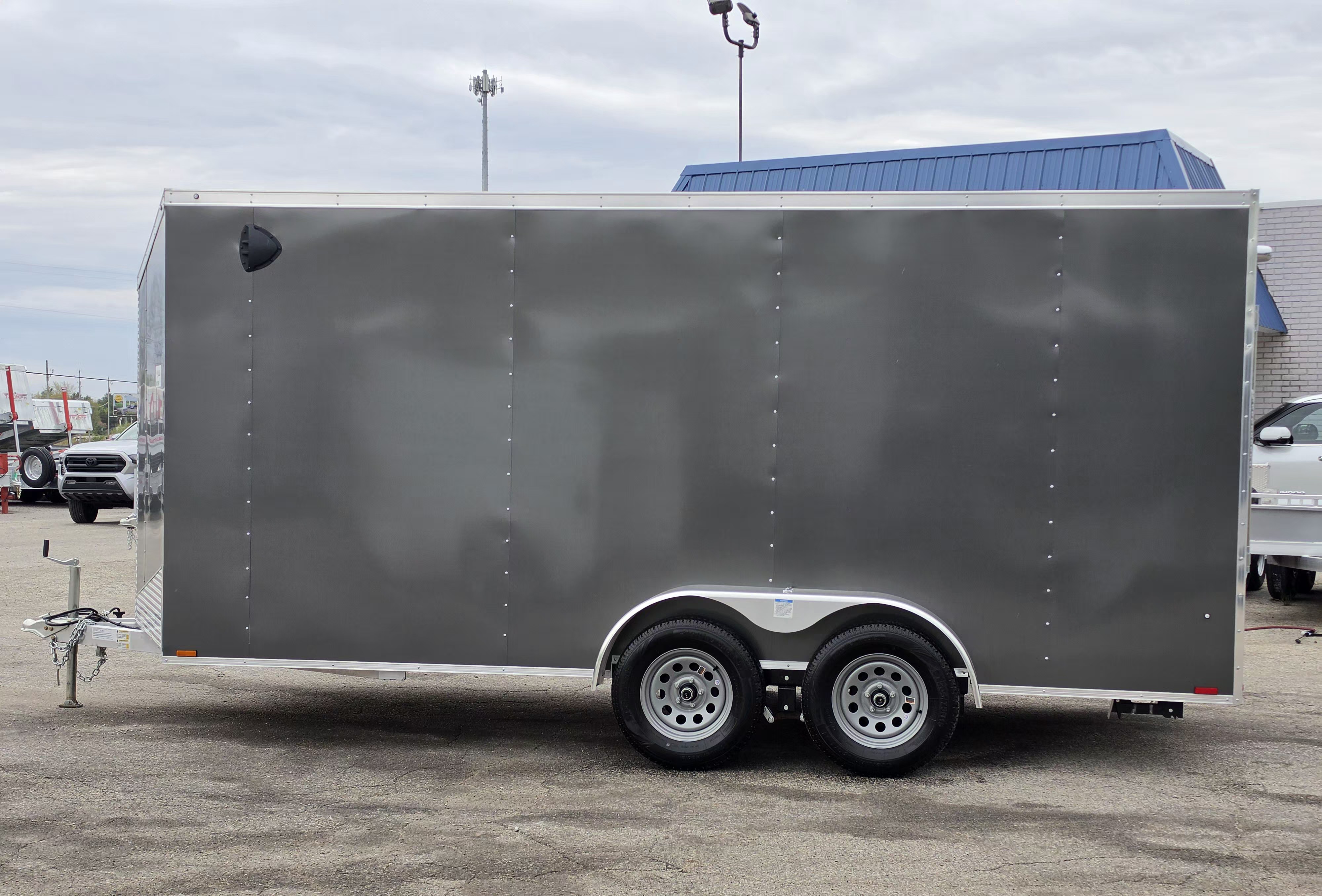 New 7 X 16 CARGO ENCLOSED TANDEM AXLE ALL ALUMINUM LIGHTNING 2026 REAR RAMP DOOR