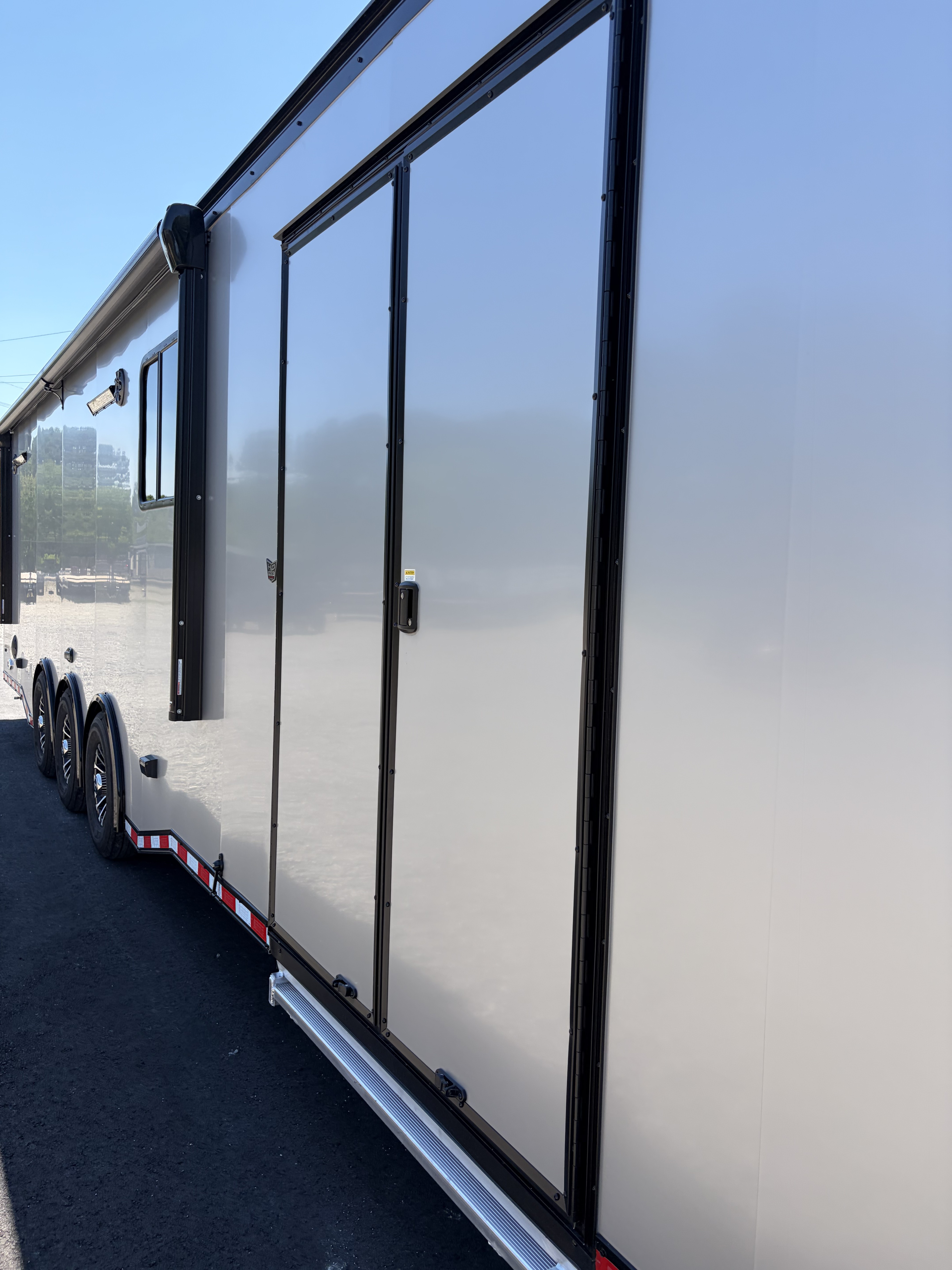 New 2026 Haulmark 34 Bathroom Race Trailer, Air Prep PKG, Awning, Polycor, Insulated, Window, 54" ALX Slide Out Step, A/C + Heat