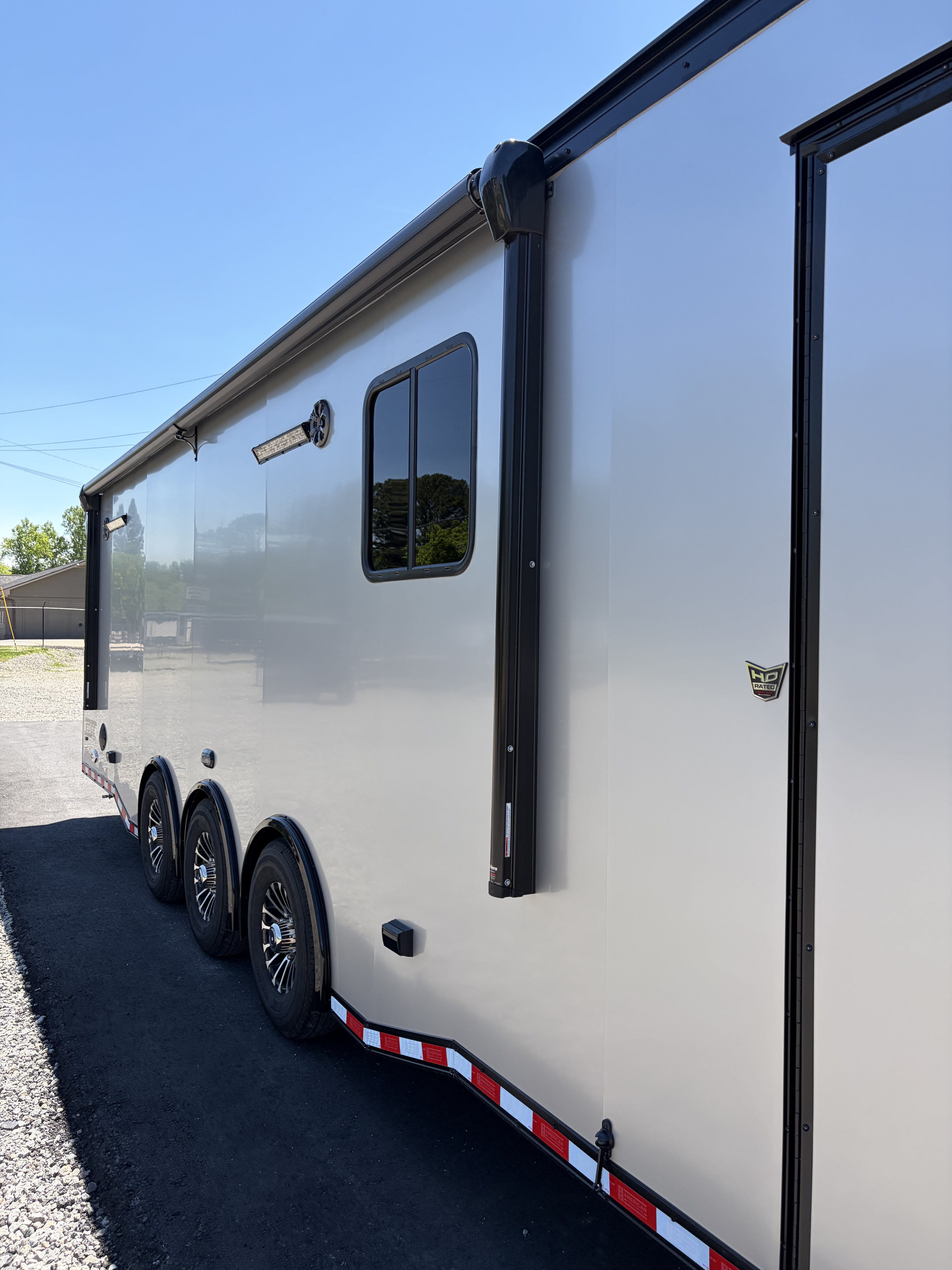 New 2026 Haulmark 34 Bathroom Race Trailer, Air Prep PKG, Awning, Polycor, Insulated, Window, 54" ALX Slide Out Step, A/C + Heat