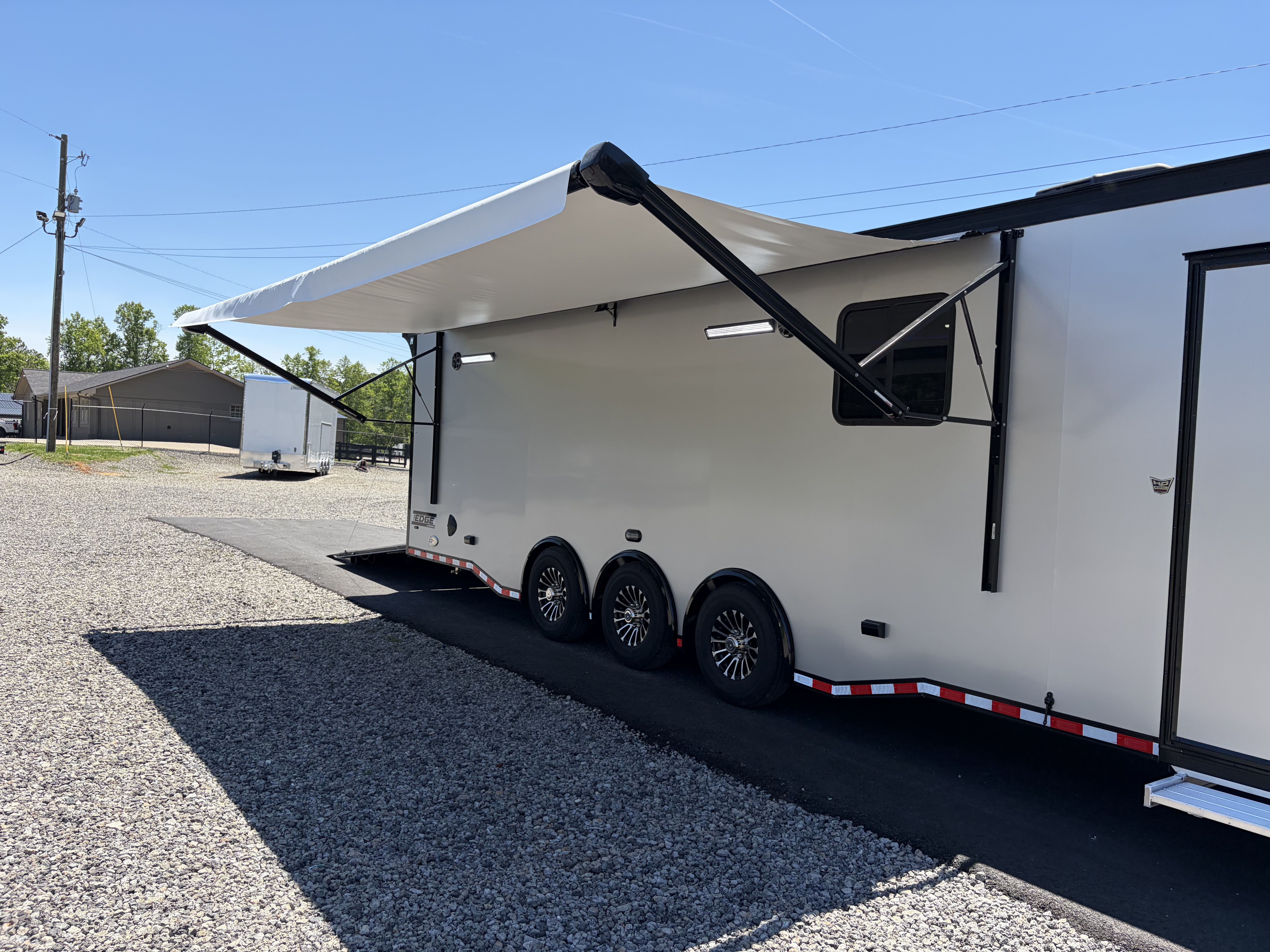 New 2026 Haulmark 34 Bathroom Race Trailer, Air Prep PKG, Awning, Polycor, Insulated, Window, 54" ALX Slide Out Step, A/C + Heat