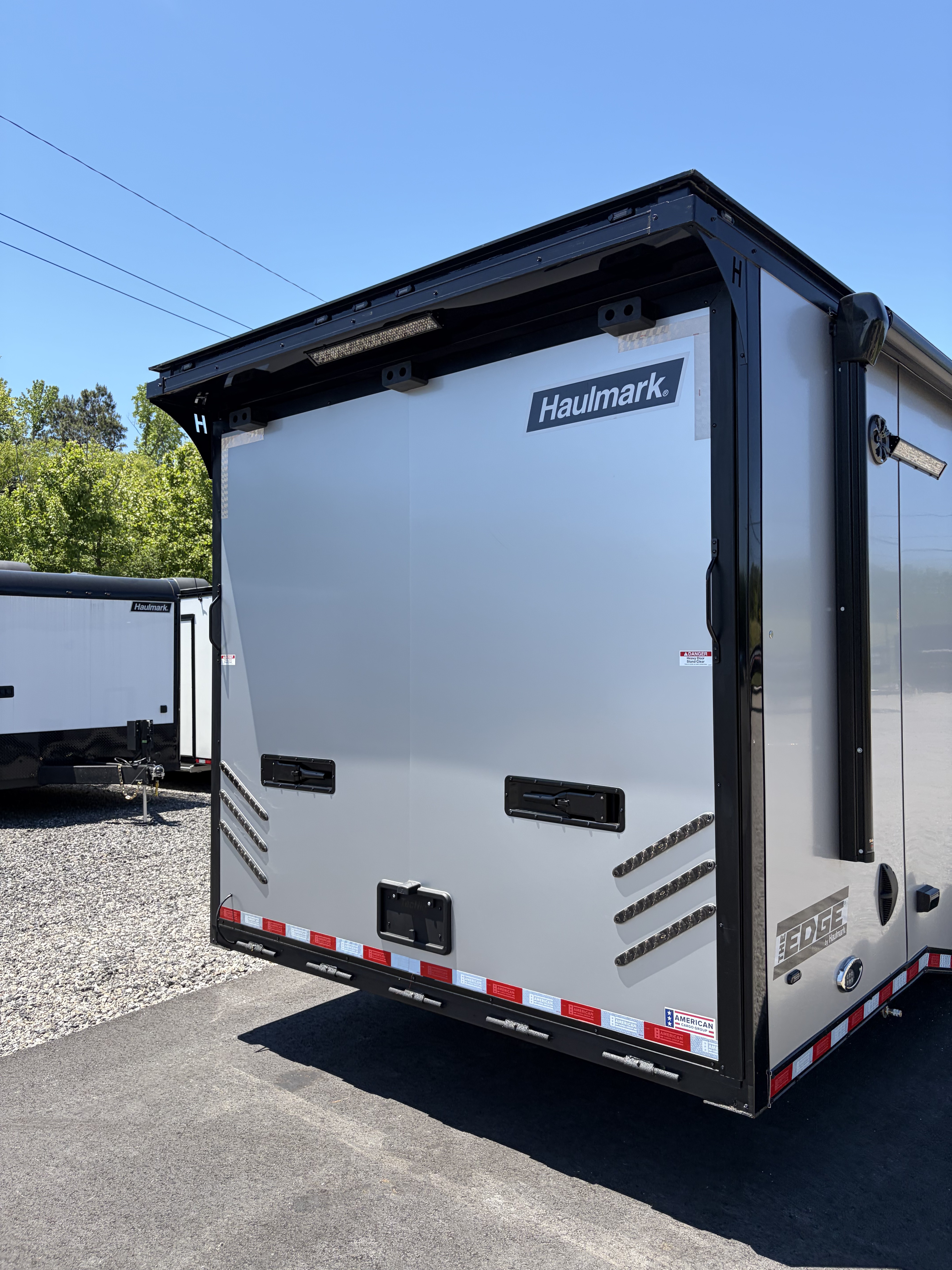 New 2026 Haulmark 34 Bathroom Race Trailer, Air Prep PKG, Awning, Polycor, Insulated, Window, 54" ALX Slide Out Step, A/C + Heat