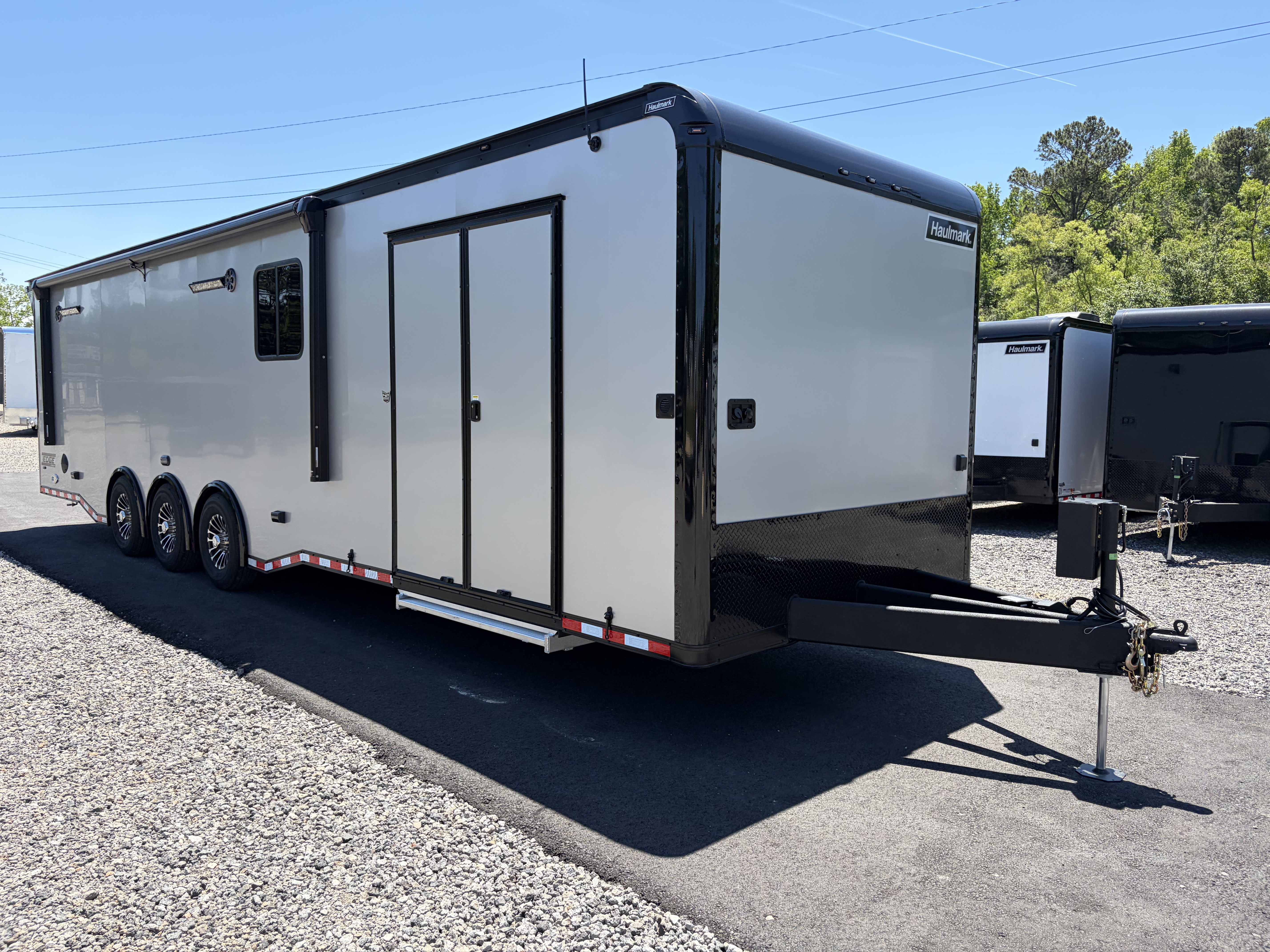 New 2026 Haulmark 34 Bathroom Race Trailer, Air Prep PKG, Awning, Polycor, Insulated, Window, 54" ALX Slide Out Step, A/C + Heat