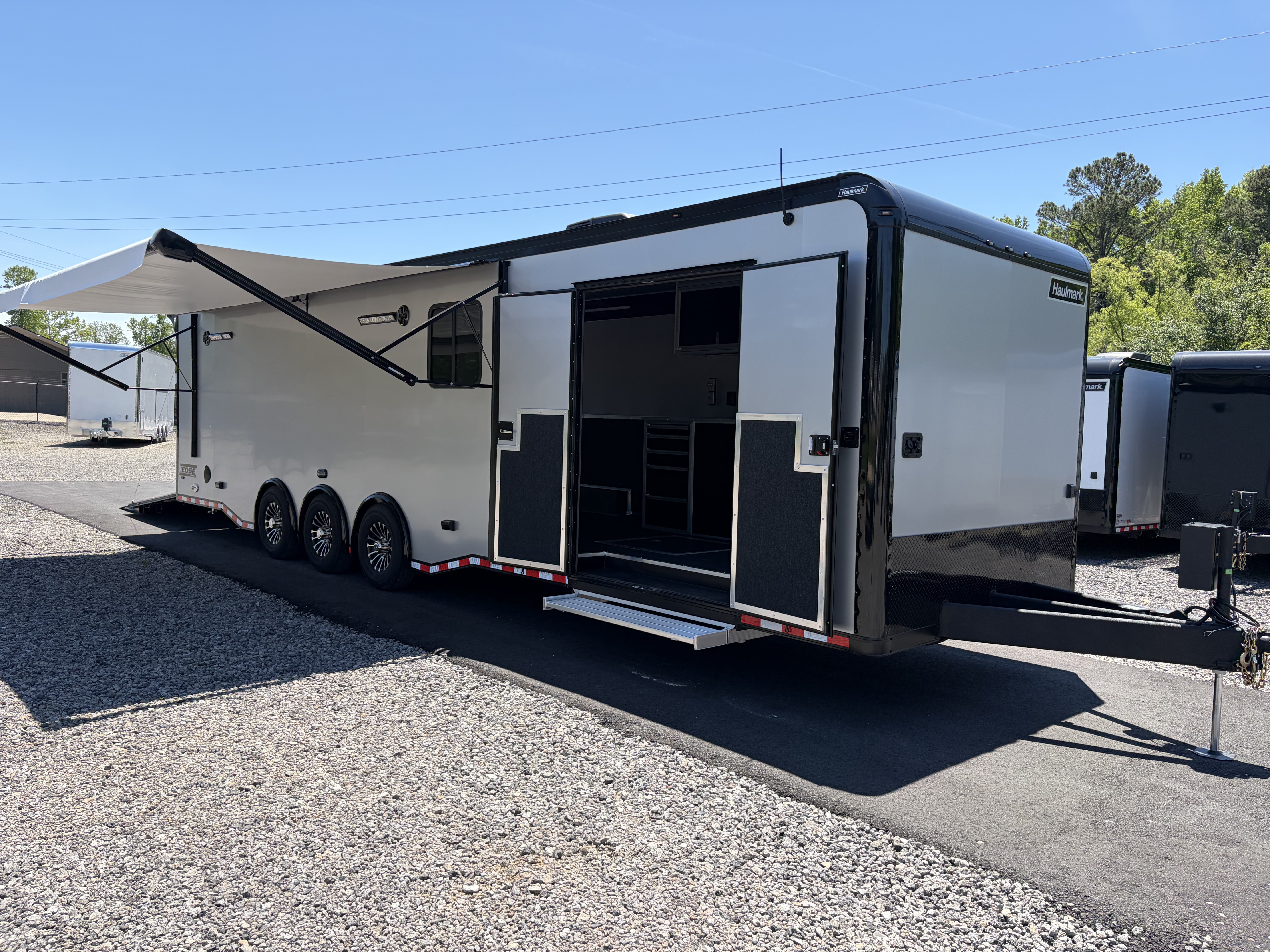 New 2026 Haulmark 34 Bathroom Race Trailer, Air Prep PKG, Awning, Polycor, Insulated, Window, 54" ALX Slide Out Step, A/C + Heat