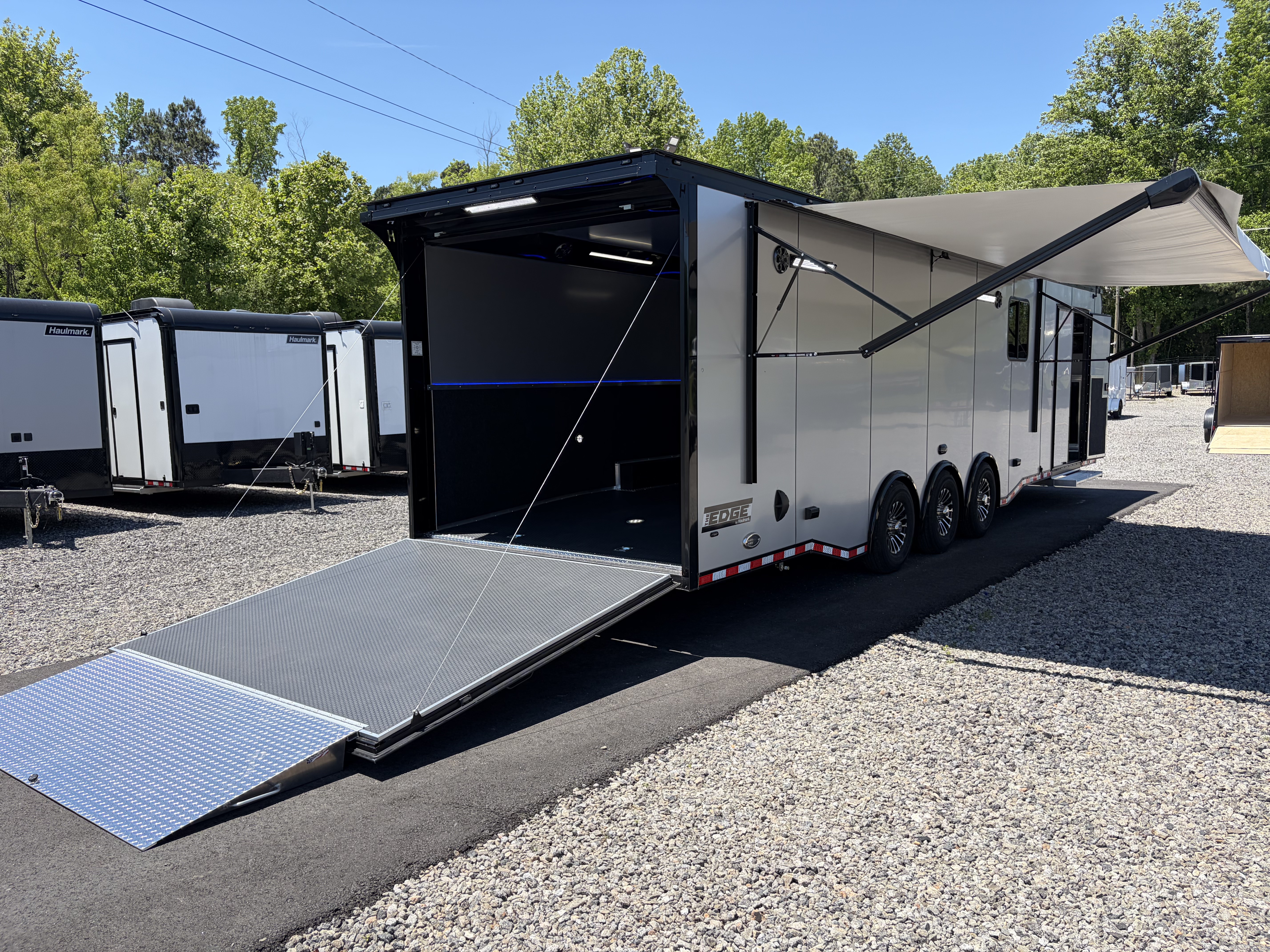 New 2026 Haulmark 34 Bathroom Race Trailer, Air Prep PKG, Awning, Polycor, Insulated, Window, 54" ALX Slide Out Step, A/C + Heat